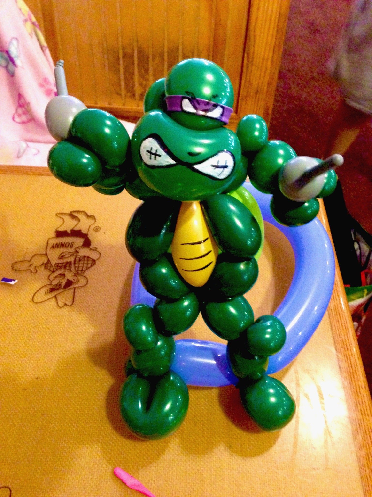Balloon sculpture of a green turtle character