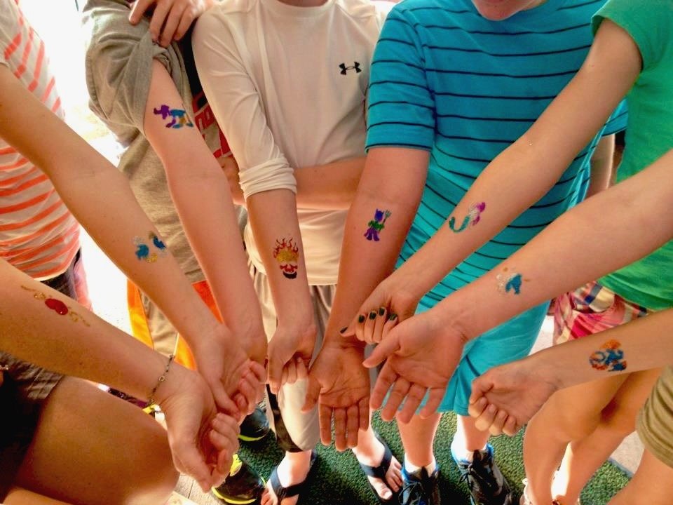 Sparkly glitter tattoo art on child's arm
