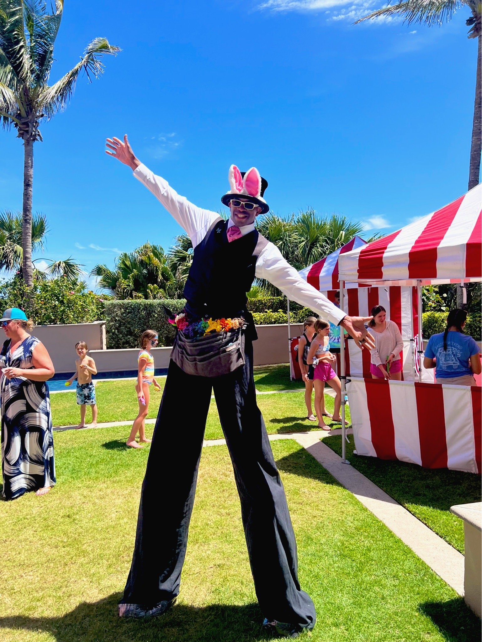Stilt walker performing at a colorful Florida event